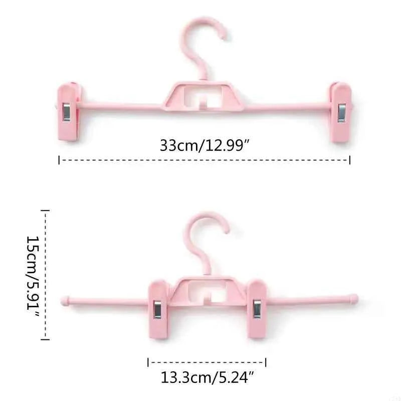 Cintre pour étendoir à linge avec pinces réglables