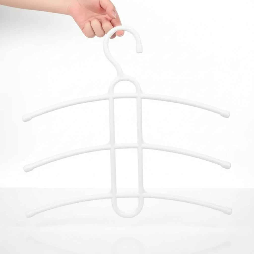 Cintre pour étendoir à linge trois niveaux gain de place