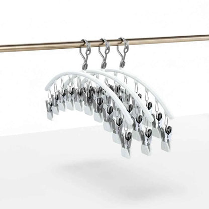 Cintre pour étendoir à linge avec pinces antidérapantes