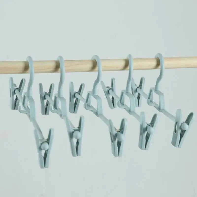 Cintre pour étendoir à linge avec pinces réglables