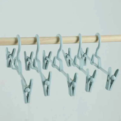 Cintre pour étendoir à linge avec pinces réglables