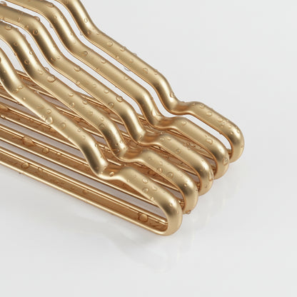 Cintre pour étendoir à linge aluminium doré