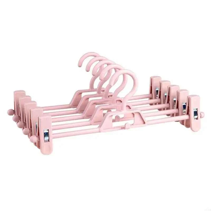 Cintre pour étendoir à linge avec pinces réglables