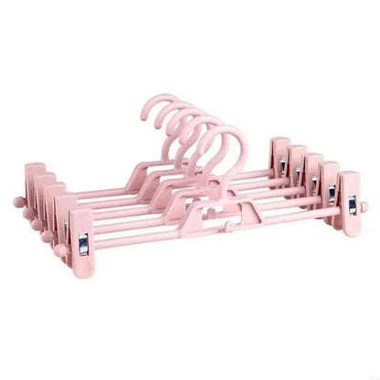 Cintre pour étendoir à linge avec pinces réglables